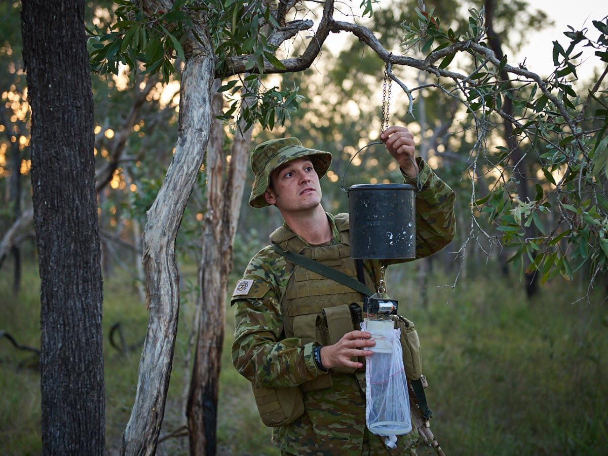 A member of the Army filters fresh water in the outback.
